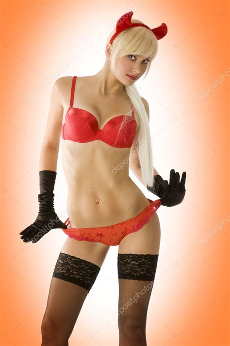 Sexy Blond Girl Red Lingerie Demon Horns Black Stocking Gloves Stock