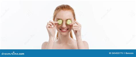 Close Up Beauty Portrait Of A Smiling Beautiful Half Naked Woman Holding Cucumber Slices At Her