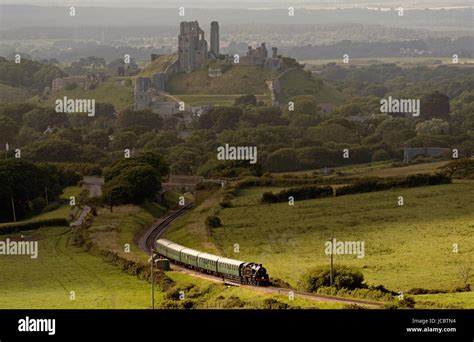 Steam Train With A Backdrop Of Corfe Castle On The Swanage Railway In