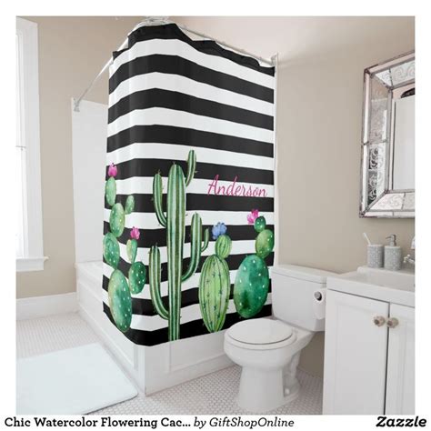 A Bathroom With A Black And White Striped Shower Curtain That Has A