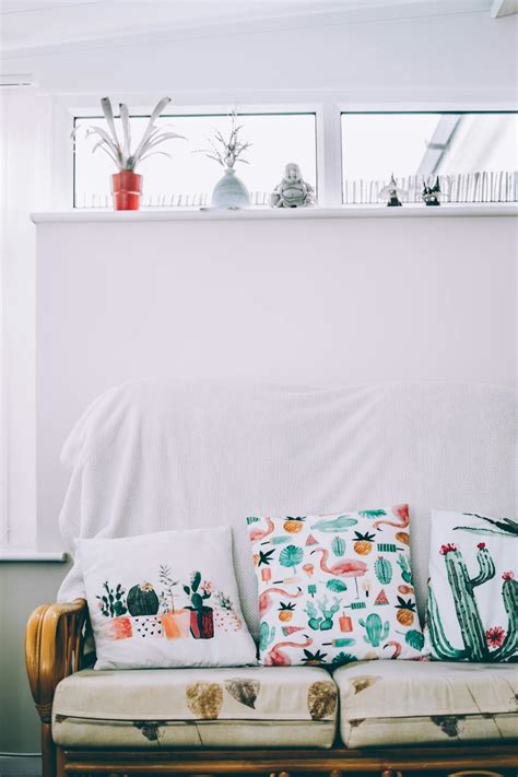 Three Assorted Throw Pillows on Couch · Free Stock Photo