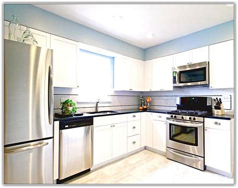 White Kitchen Cabinets Stainless Steel Appliances White Kitchen