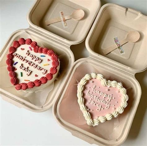 Three Heart Shaped Cakes In Small Trays With Spoons And Forks On The Side