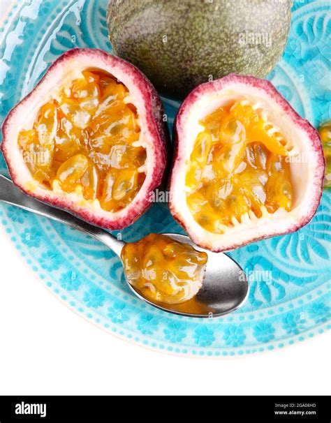 Passion Fruit On Plate Isolated On White Stock Photo Alamy