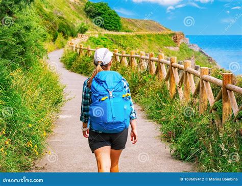 Lonely Pilgrim With Backpack Walking The Camino De Santiago In Spain