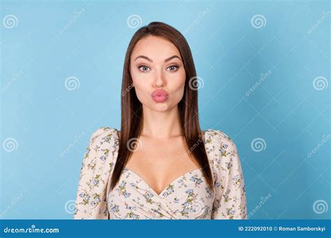 Photo Of Flirty Brunette Hairdo Young Lady Blow Kiss Wear Floral Blouse Isolated On Blue Color