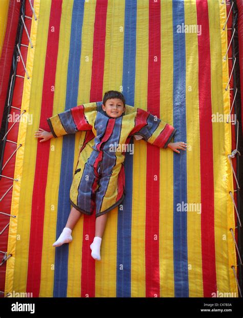 Boy Playing On Velcro Sticky Wall In Colorful Suit Stock Photo Alamy