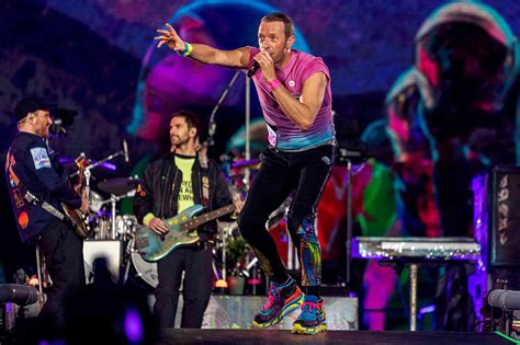 Coldplay halts concert in Athens after comedian attempts to rush stage with Israeli flag and falls