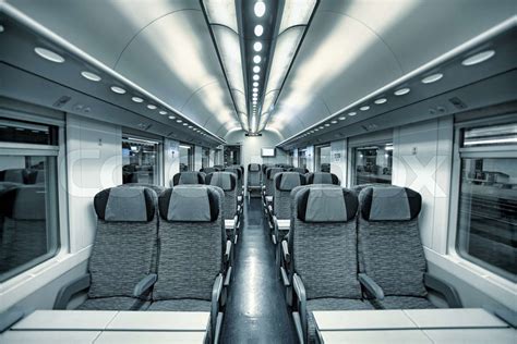 Interior View Of Modern Intercity High Speed Train Coach With Rows Of