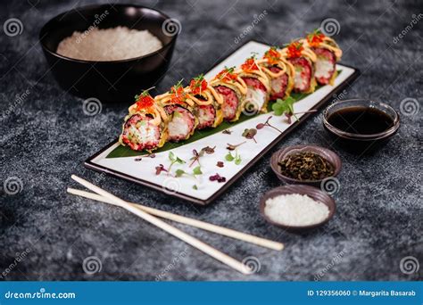 Various Kinds Of Sushi Served On Black Stone Stock Photo Image Of