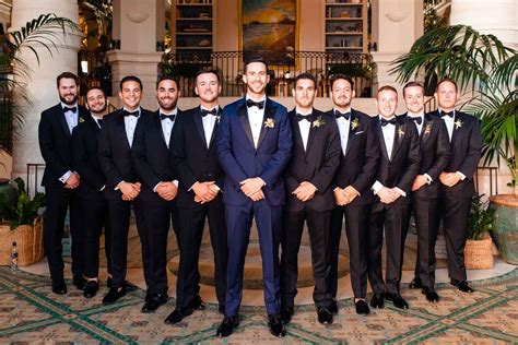 Groom In Navy Tux With Groomsmen In Tuxedos