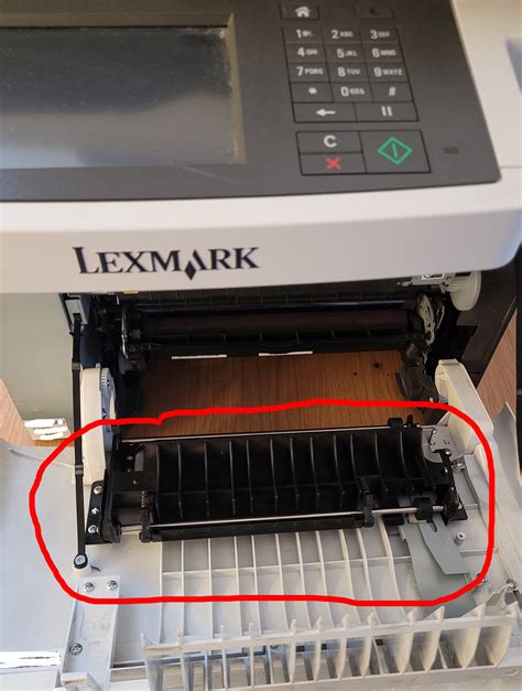 Lexmark CX 517de poszukiwany element na zdjęciu przyczyna zacinania