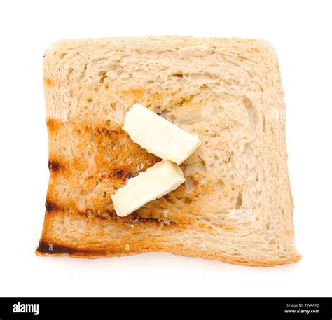 Toasted bread with butter on white background Stock Photo - Alamy