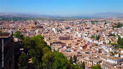 Enjoy The View Over The Red Roofs Of Granada From The Walls Of Alhambra