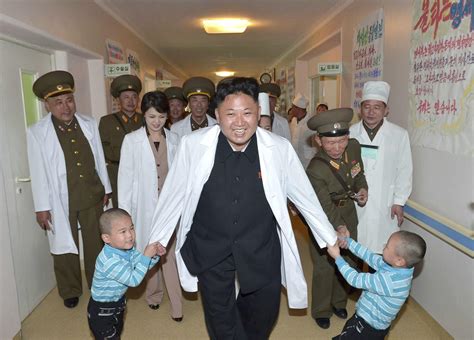 File photo shows North Korean leader Kim Jong un playing with children ...