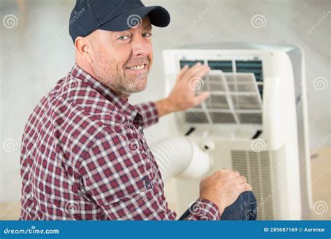 Man Fixing And Maintaining Air Conditioning System Stock Image Image