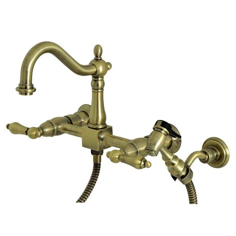 Kingston Brass Heritage 2 Handle Wall Mount Kitchen Faucets With Brass Sprayer In Antique Brass