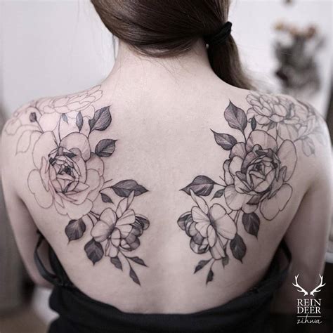 Matching Illustrative Tattoos On The Shoulder Blades