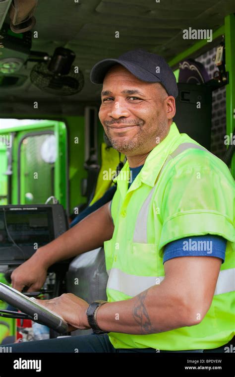 African American Man Driving Garbage Truck Stock Photo Alamy