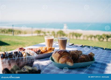 A Picnic At The Seaside Beach Breakfast With Coffee Croissants And