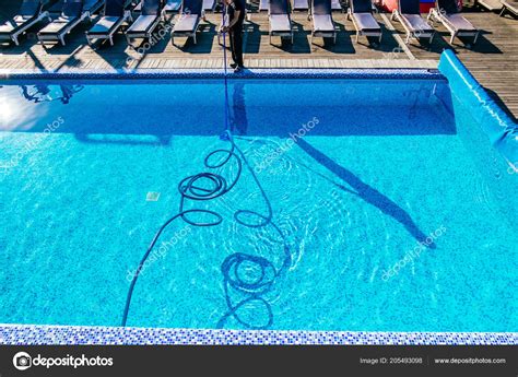 Swimming pool cleaning Stock Photo by ©toreincarnate 205493098