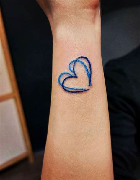 Pin on Tatuajes | Black heart tattoos, Blue tattoo, Heart outline tattoo