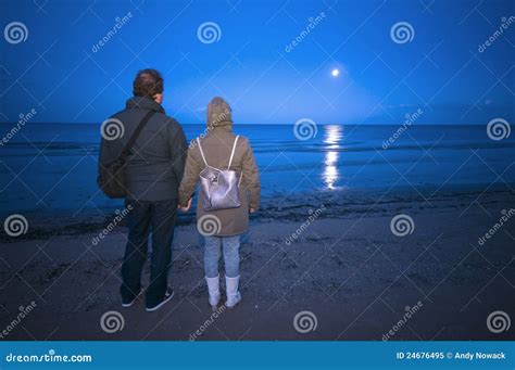 Couple On The Beach By Night Royalty Free Stock Photo - Image: 24676495