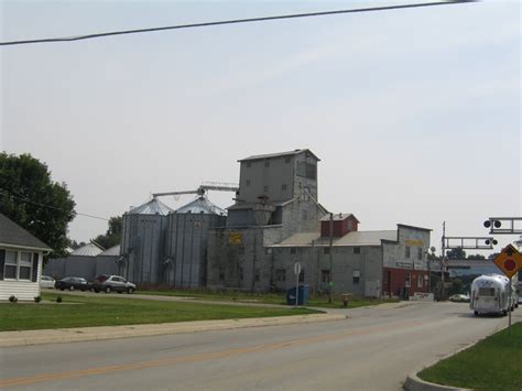 An Old Factory Sits On The Corner Of A Street