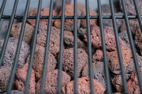 Fragment Of A Barbecue Grill And Lava Stones Selective Focus Stock