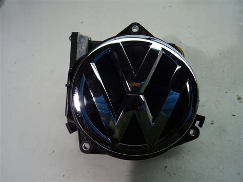 VW GOLF VII KLAMKA KLAPY KAMERA COFANIA LOGO EMBLEMAT 5G9827469E