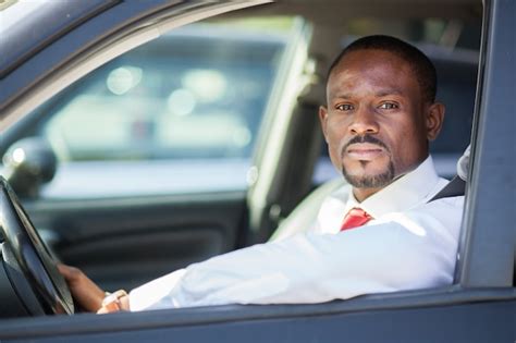 premium photo black guy driving  car