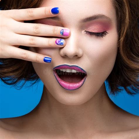 Beautiful Model Girl With Bright Makeup And Colored Nail Polish Beauty