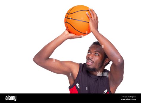 Basketball Player Launching The Ball Isolated On White Background