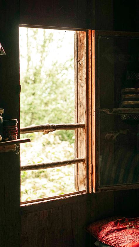 A Brick House With A Wooden Windows · Free Stock Photo