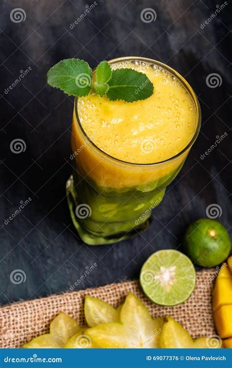 Yellow Two-colored Smoothies with Tropical Fruits Stock Photo - Image ...