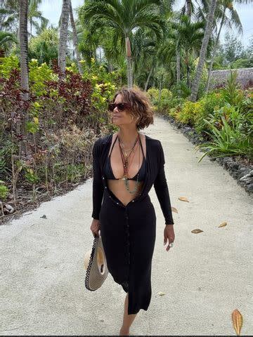 Halle Berry Stuns In A Plunging Unbuttoned Dress Over Tiny Bikini During Romantic Getaway
