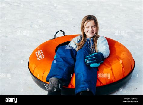 Kids playing the Snow and Tubing Stock Photo - Alamy