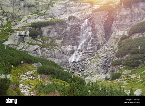 mountain waterfall sunset Stock Photo - Alamy