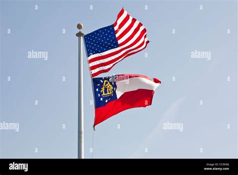 American flag flies above the flag of the state of Georgia, USA Stock Photo - Alamy