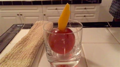 How to Make a Really Cool Ice Ball Cocktail That Is Served by Cracking It Open With a Tiny Hammer