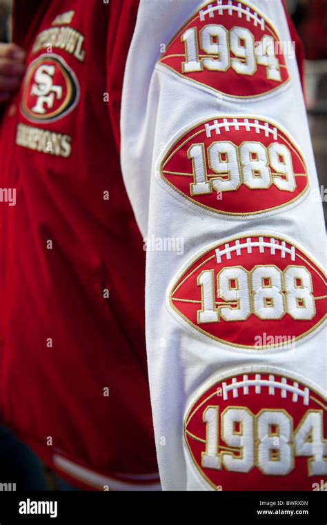 A San Francisco 49er Fan Wears A Varsity Letter Jacket Detailing 4 Of Their 5 Super Bowl