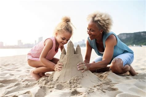 Premium AI Image Shot Of A Lesbian Couple And Their Daughter Building A Sand Castle At The Beach