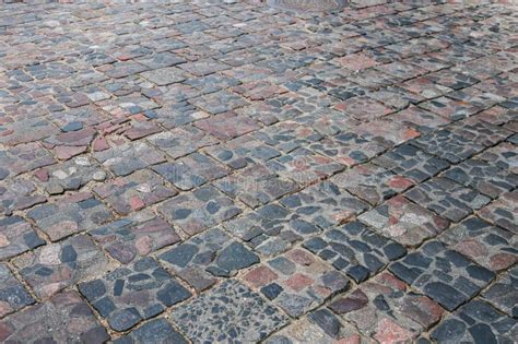 Abstract Background Of Old Cobblestone Pavement Close Up Stock Image