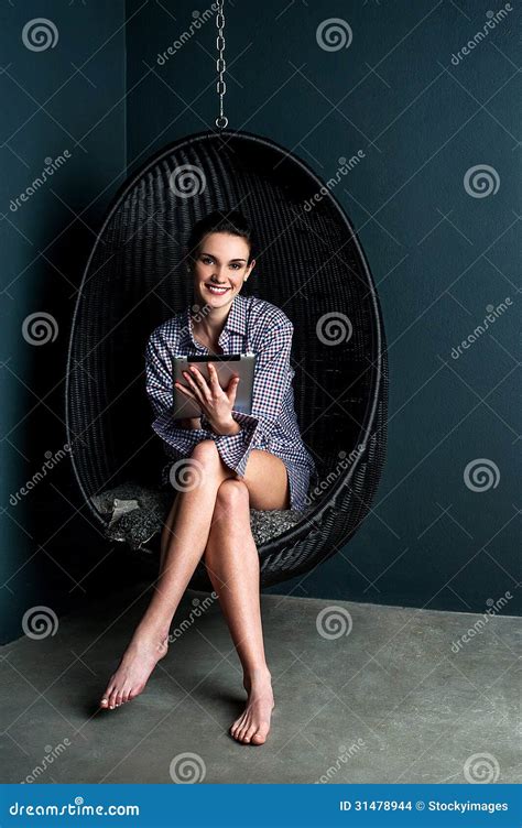 Woman Sitting In Bubble Chair Operating Touch Pad Stock Photo Image