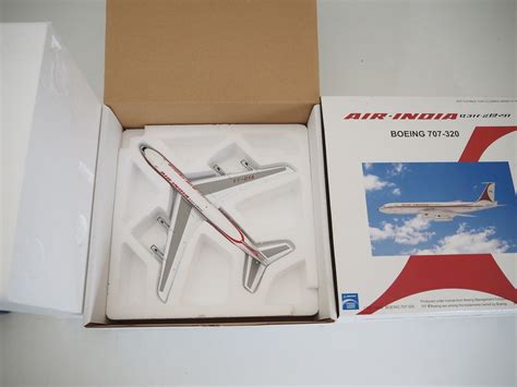 Lot 15 - A pair of diecast model airplanes comprising