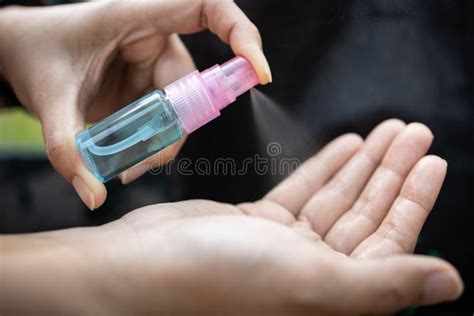 Asian Woman Hold A Bottle Of Alcohol Disinfectant Girl Is Spraying