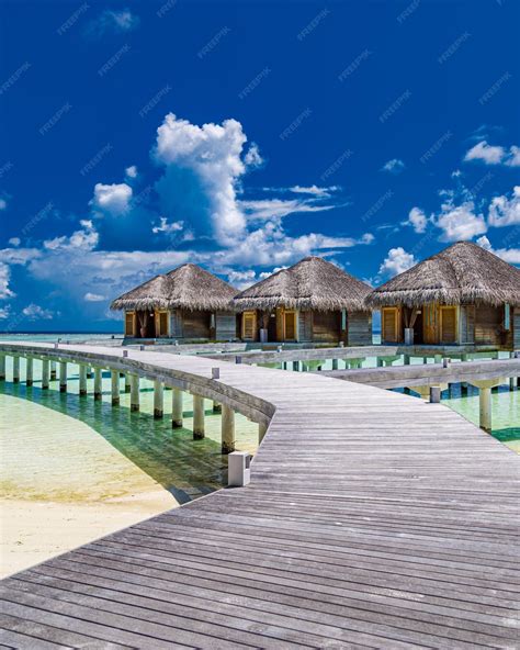 Premium Photo | Over water villas in tropical ocean turquoise lagoon