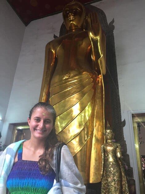 Premium Photo Portrait Of Smiling Mid Adult Woman Standing In Wat Pho