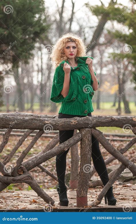 Beautiful Woman Posing In Park During Autumn Season Blonde Girl