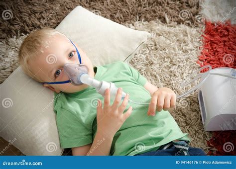 Boy Making Inhalation With Nebulizer At Home Stock Photo Image Of